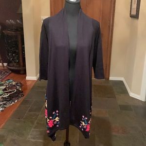 Beautiful black sweater w/ 3/4 length sleeves. Hangs longer in front & sides.NWT